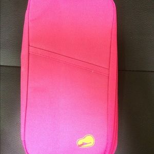 Black and pink passport and ticket holders